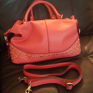 Cosmopolitan coral and gold purse